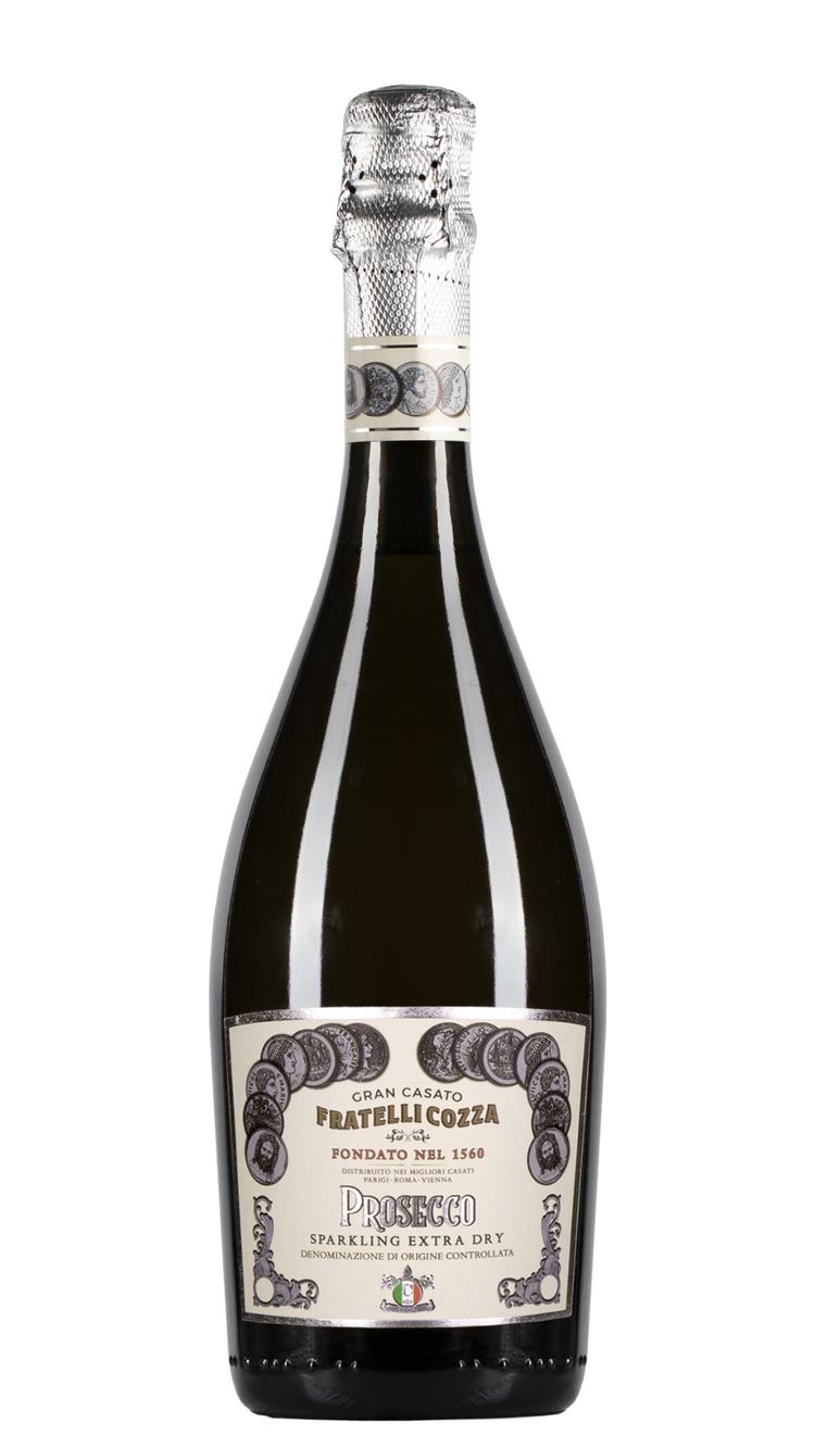 A bottle of Prosecco sparkling wine with a silver foil top and a white label featuring black and gold text and decorative coin illustrations.