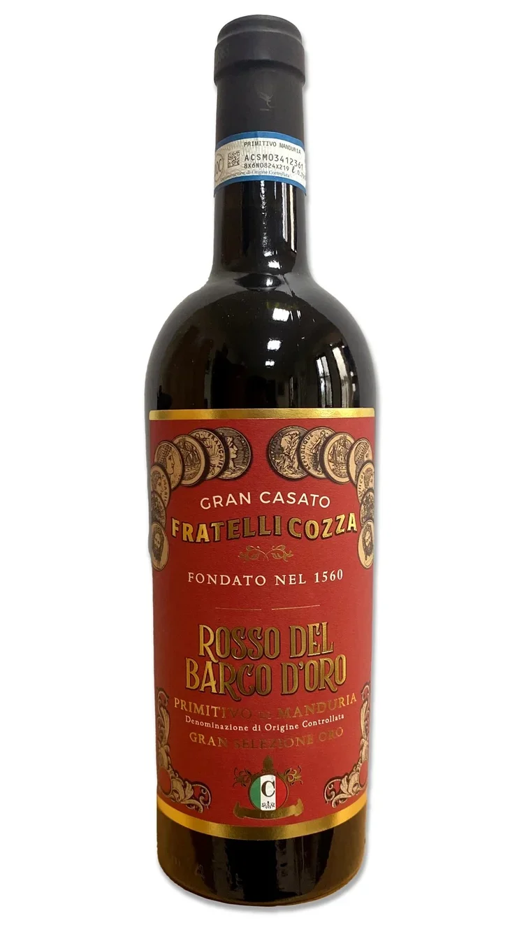A bottle of Italian wine with a red label that has gold and black accents, featuring the brand name Fratelli Cozza and the wine type Rosso del Barco d'Oro.