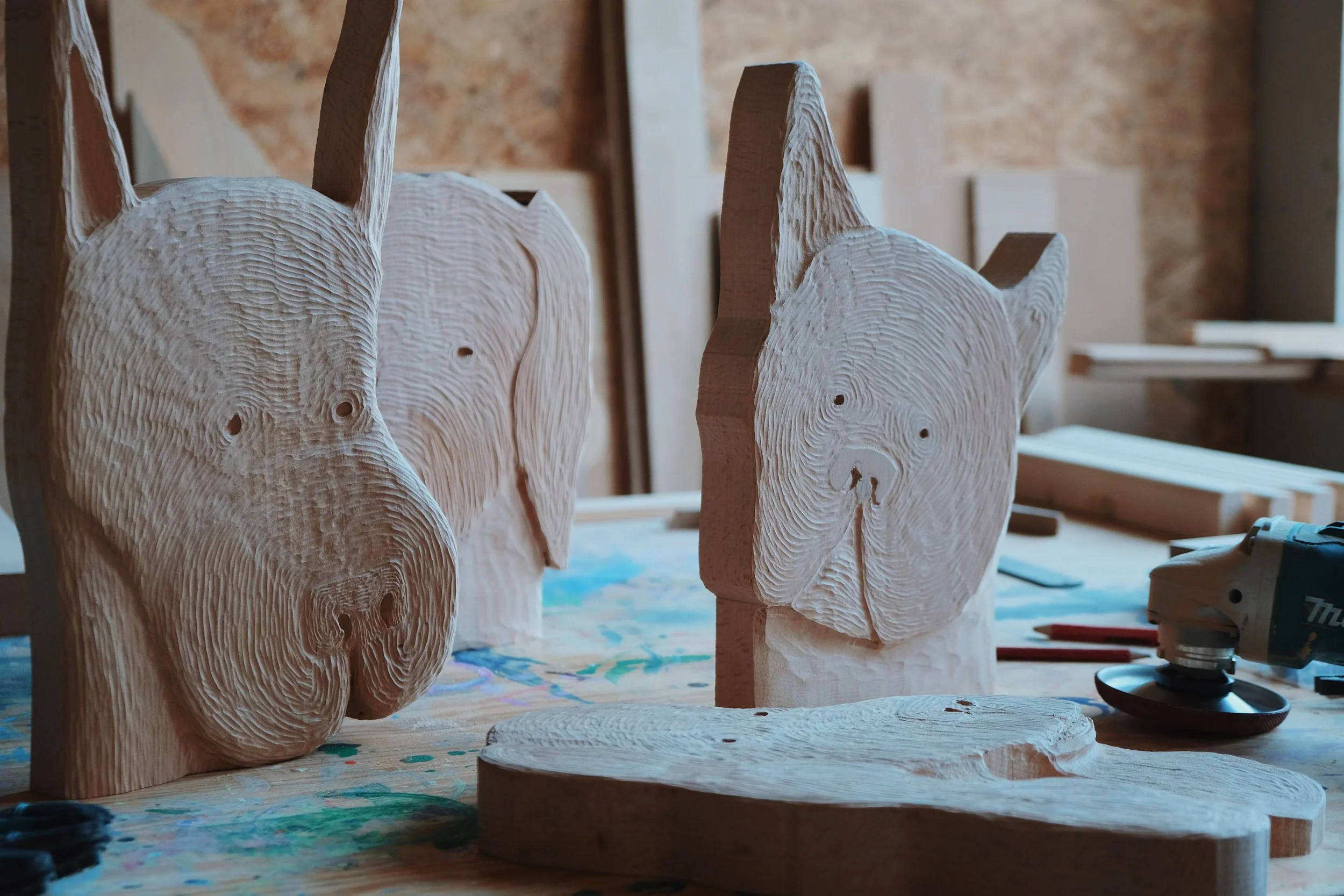 Studio shots of progress Dog sculptures.