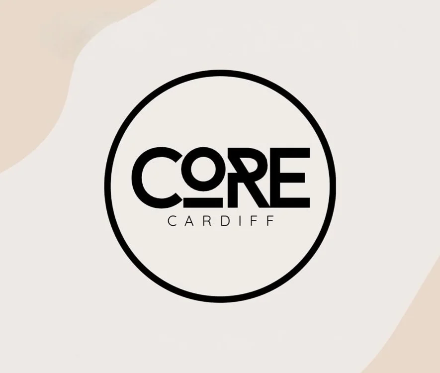 Logo with the words CORE Cardiff inside a circle on a beige and gray abstract background.