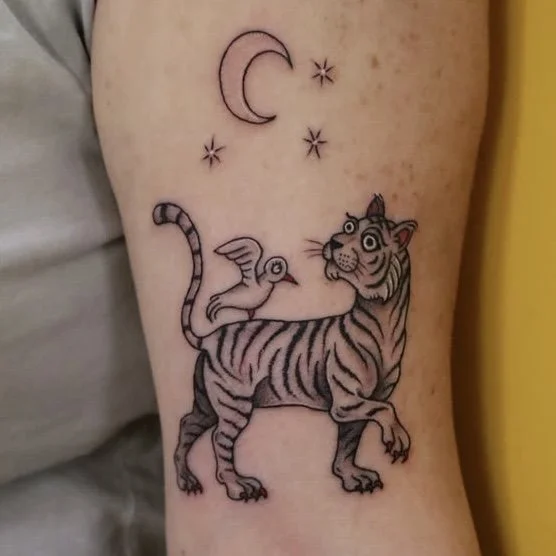 beastery tattoo of a tiger with a small winged bird on its back beneath a crescent moon and stars, whimsical illustrative style, by Daniel Emmanuel Alt-Treptow Berlin