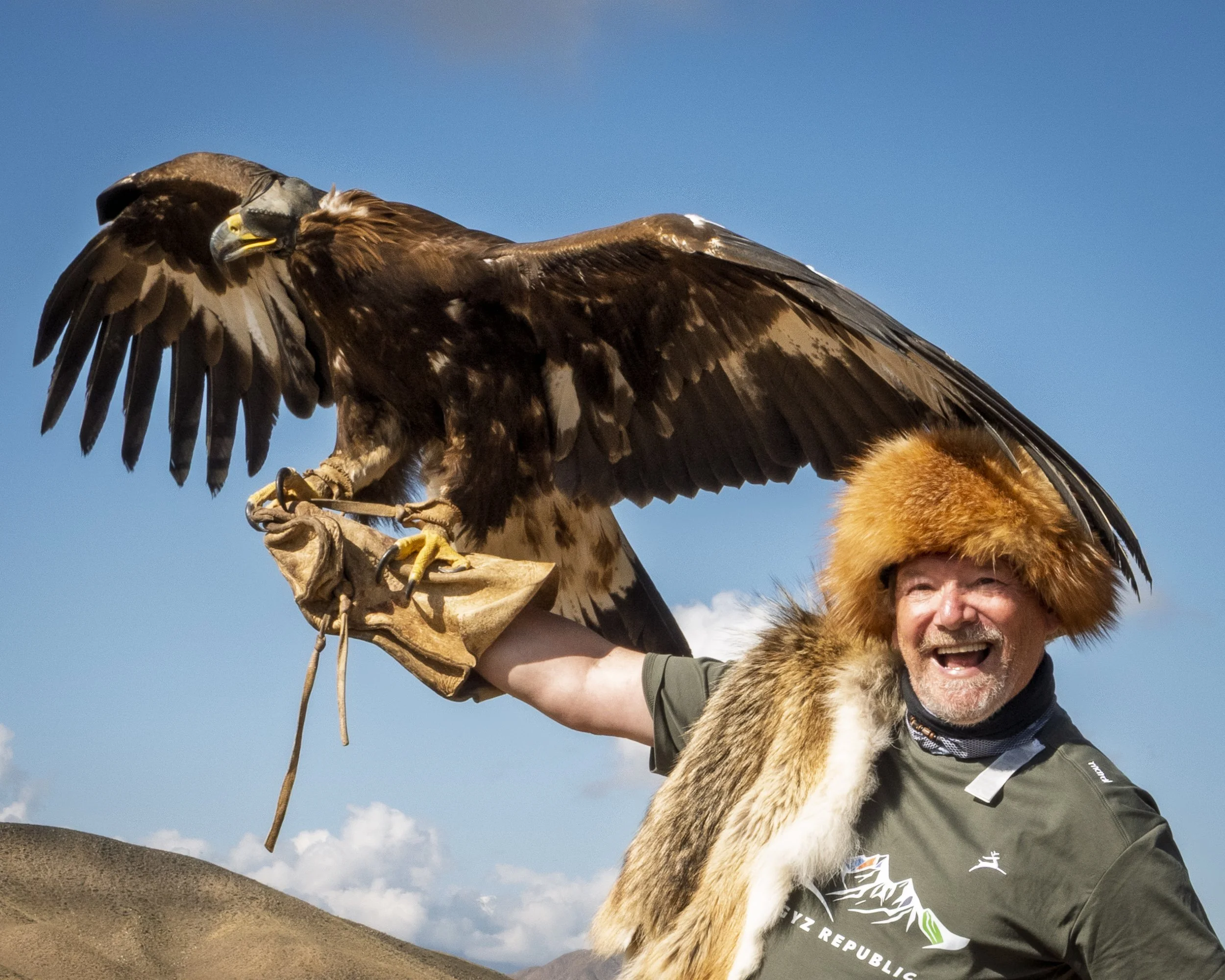 Posing with a golden eagle on the steppes of Central Asia wasn't on the bingo card