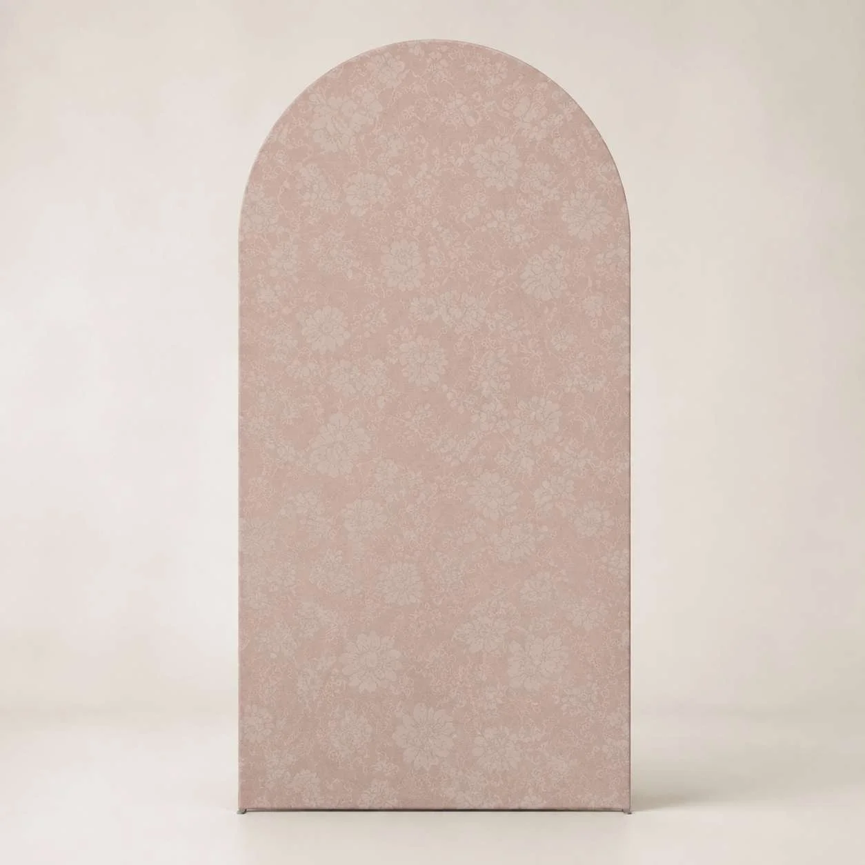 A case or box with a pastel pink floral pattern on its front surface, set against a neutral background.