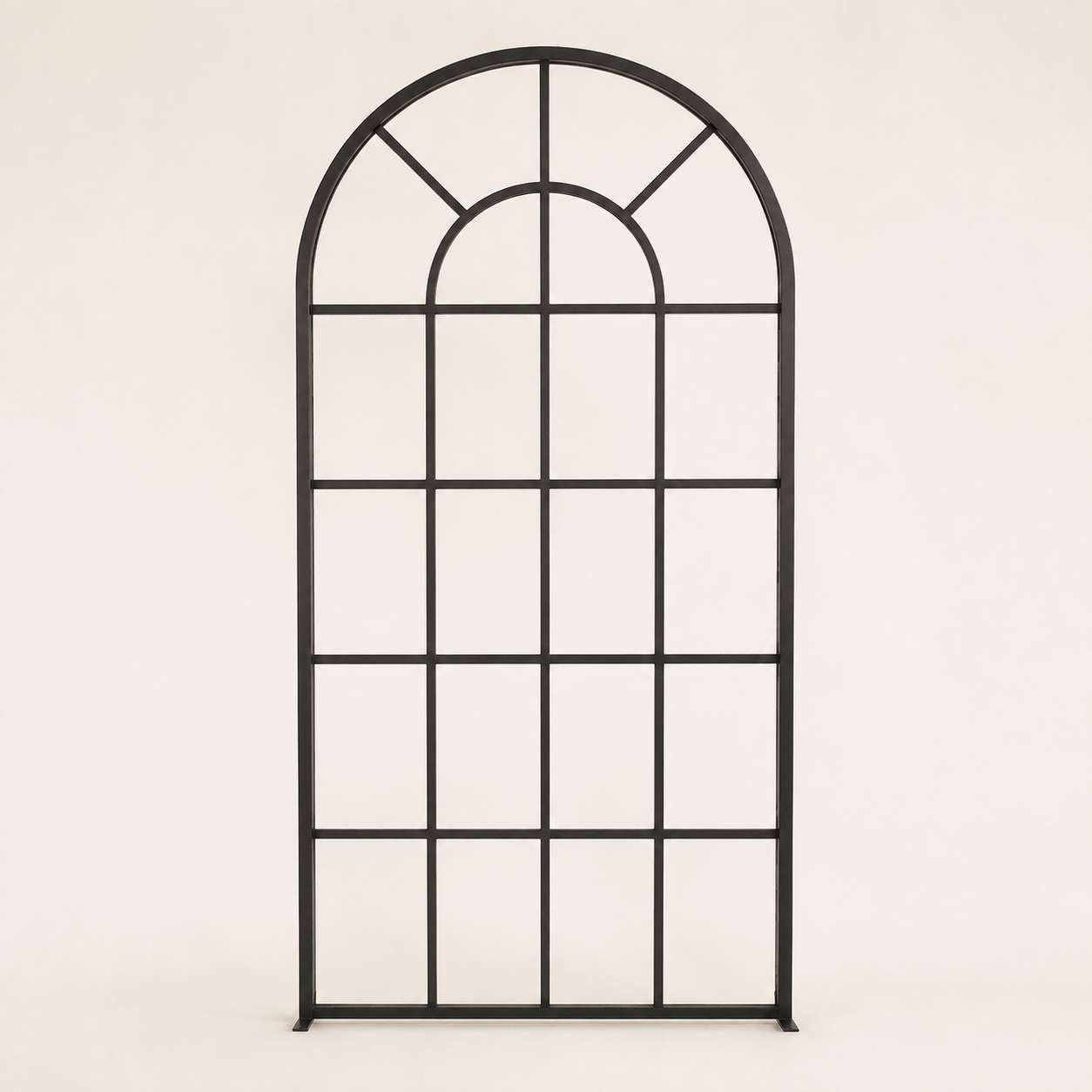 Black metal window frame with an arched top and multiple rectangular panes, set against a plain white background.