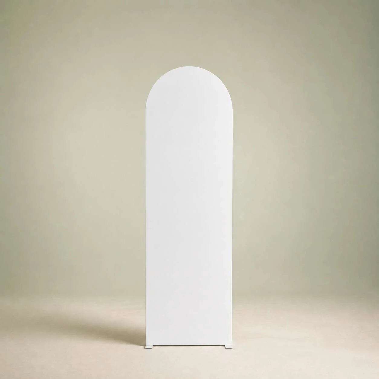 A white, minimalist arched floor lamp standing against a plain beige background.