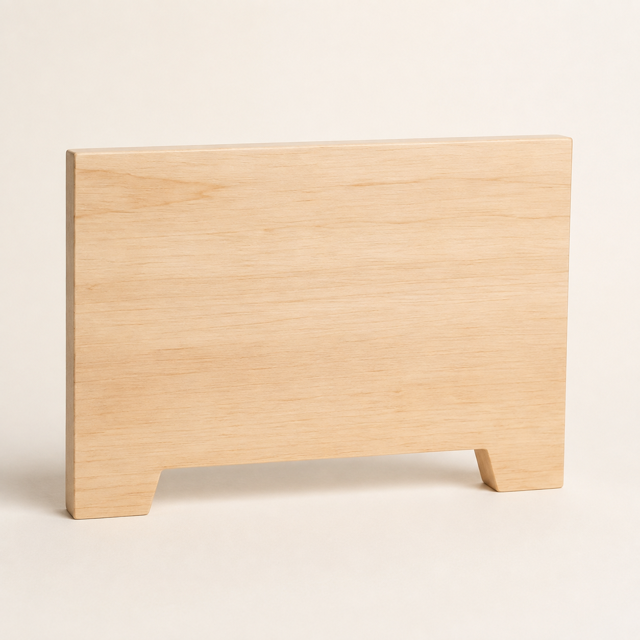 Light-colored wooden panel standing on a flat surface with a plain white background.