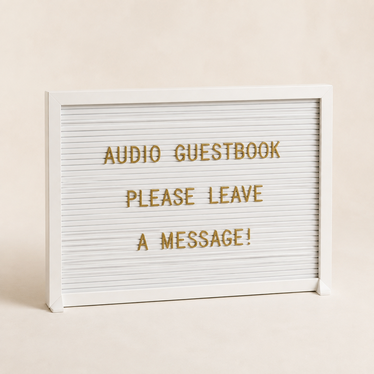 Lightbox sign with the message 'Audio Guestbook Please Leave a Message' in gold letters on a white background.