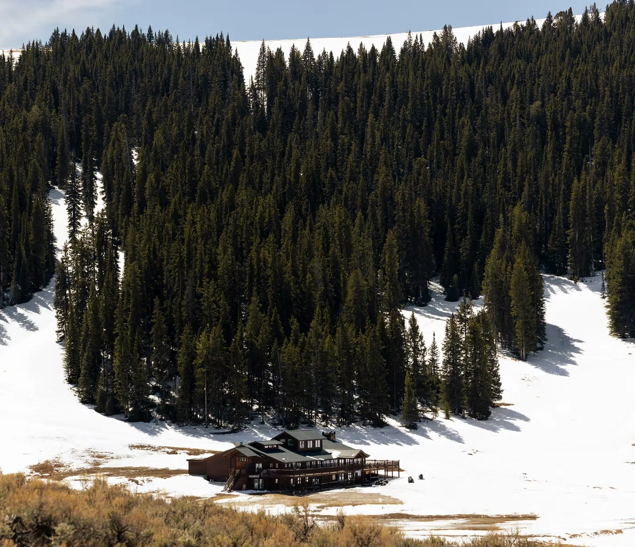 Meadowlark Lodge nestled in snow-covered pines in the Bighorn Mountains, Wyoming