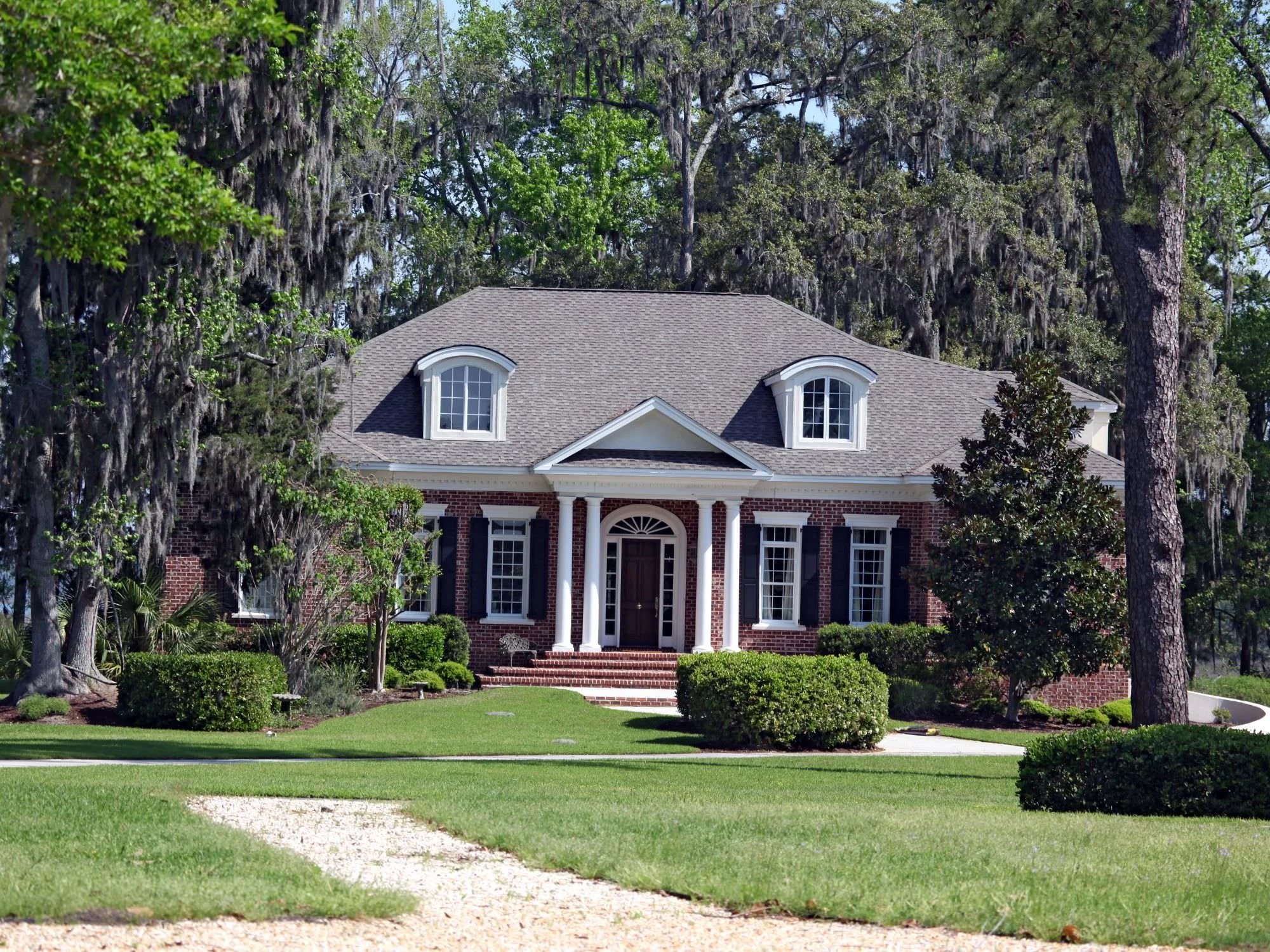 gorgeous southern home with oak trees - questions to ask a roofer