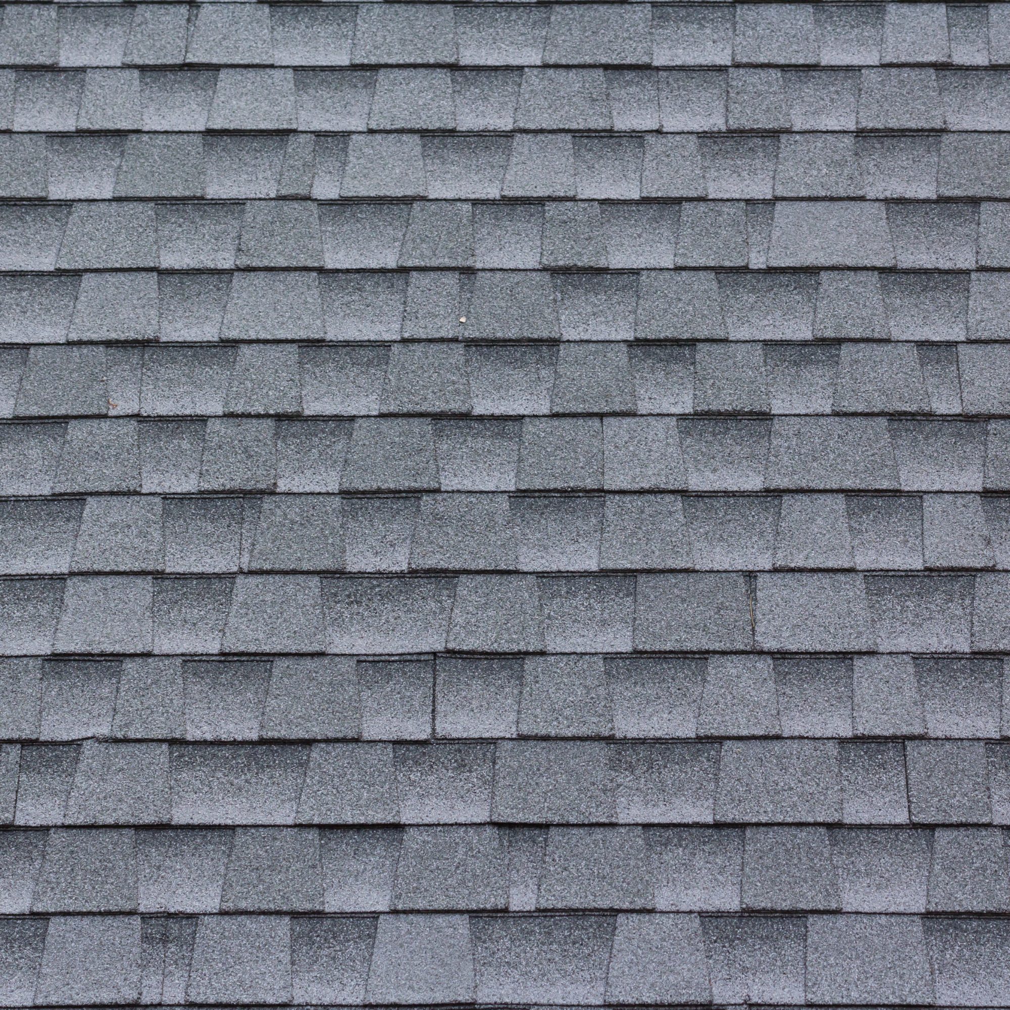 black shingles on a roof - questions to ask a roofer