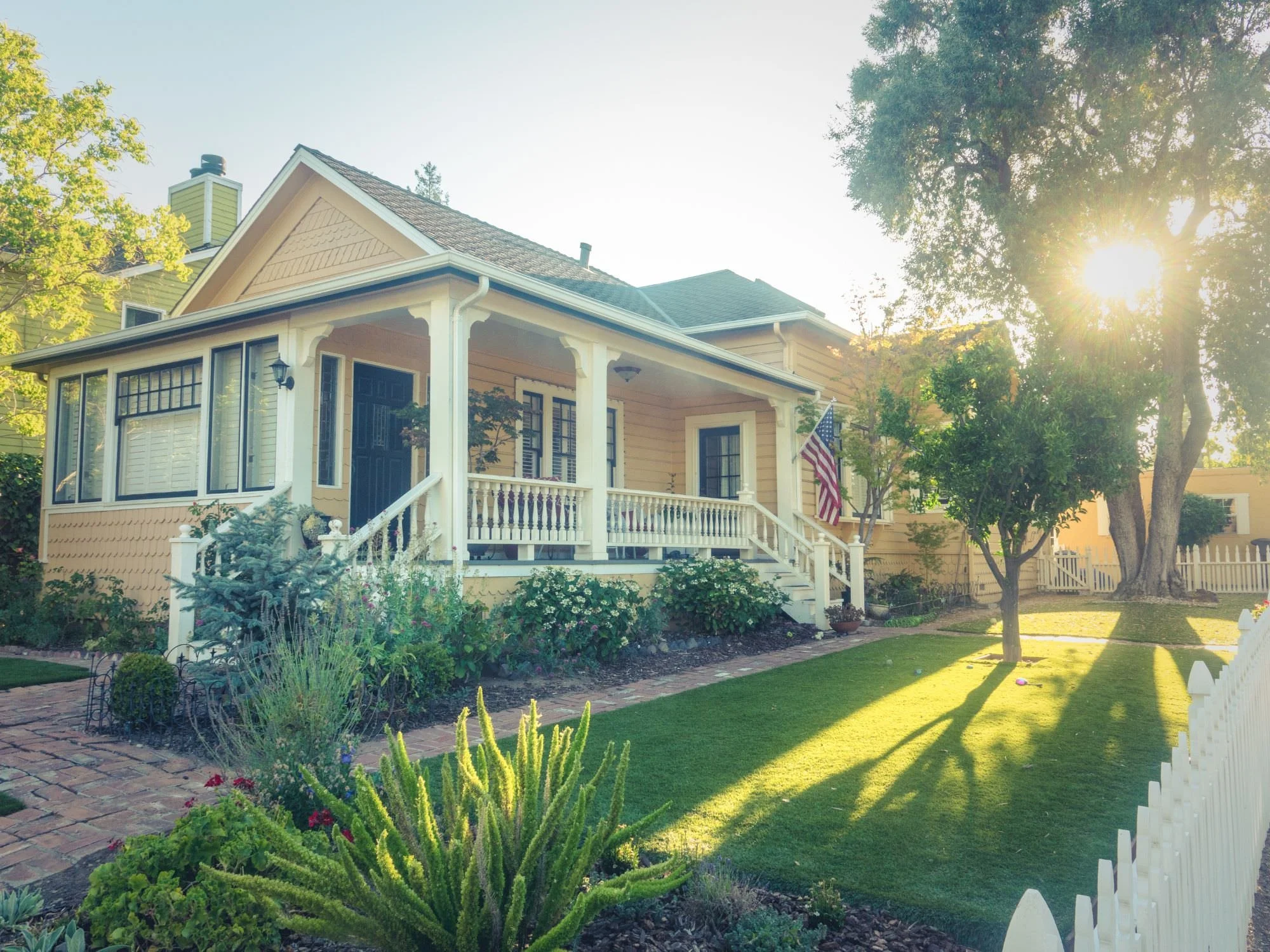 home with American Flag - questions to ask a roofer