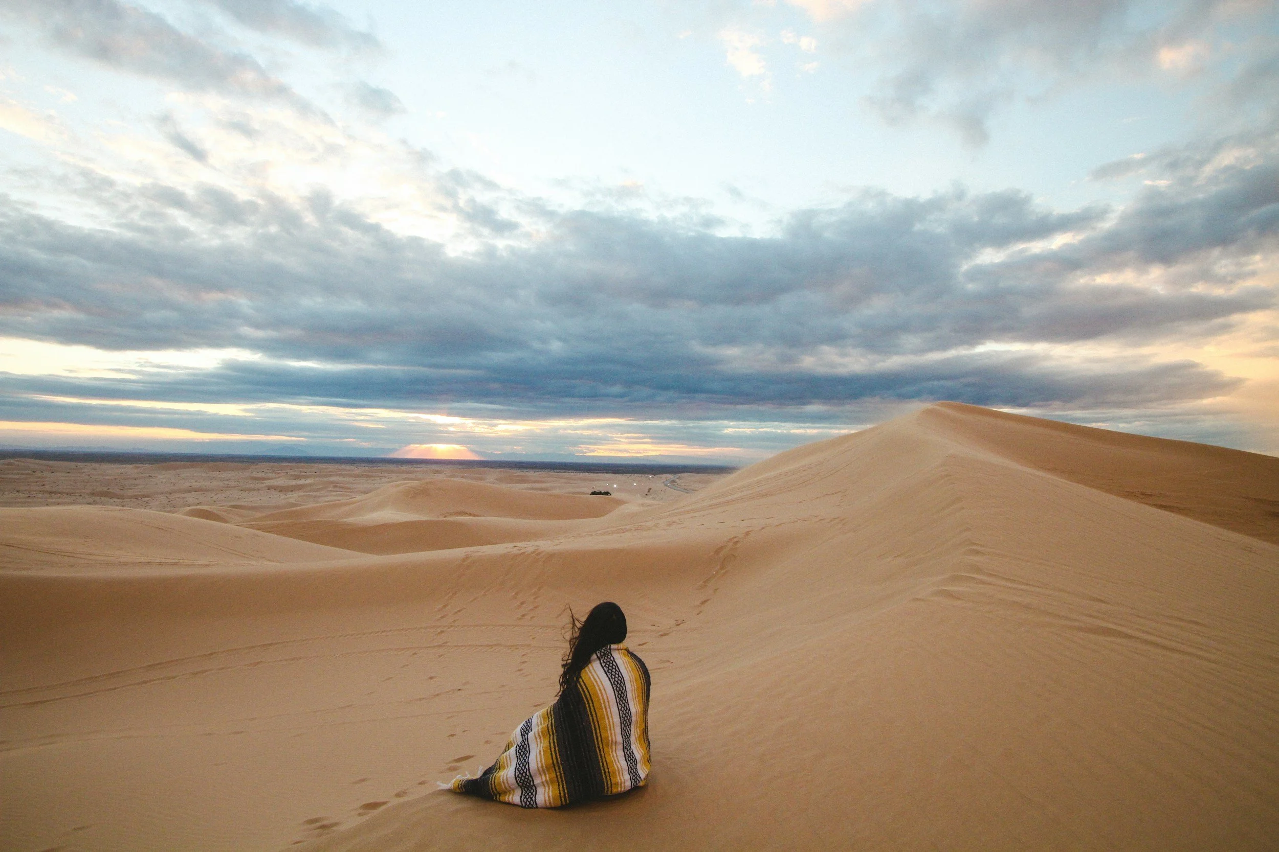 person meditating in the desert represneting in the presnece of love