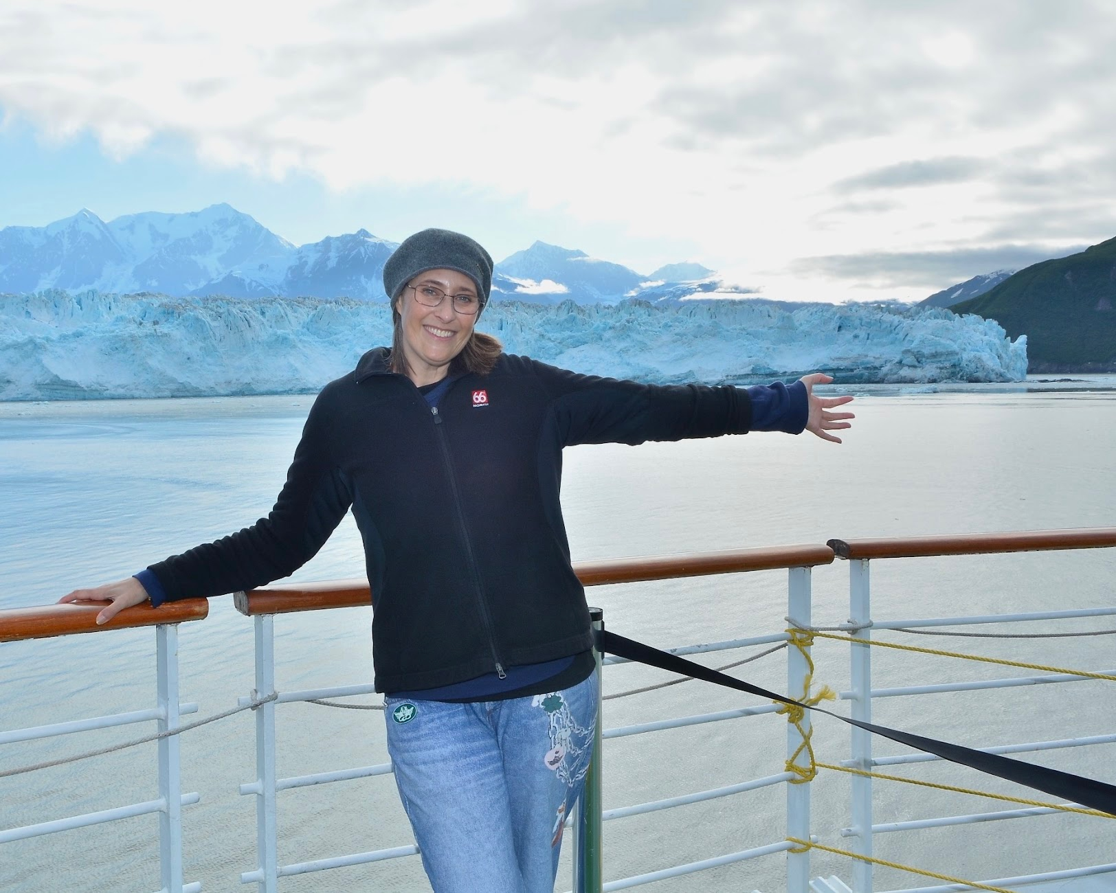 Stephanie Ng, Luxury Travel Advisor, in front of the Hubbard Glacier in Alaska