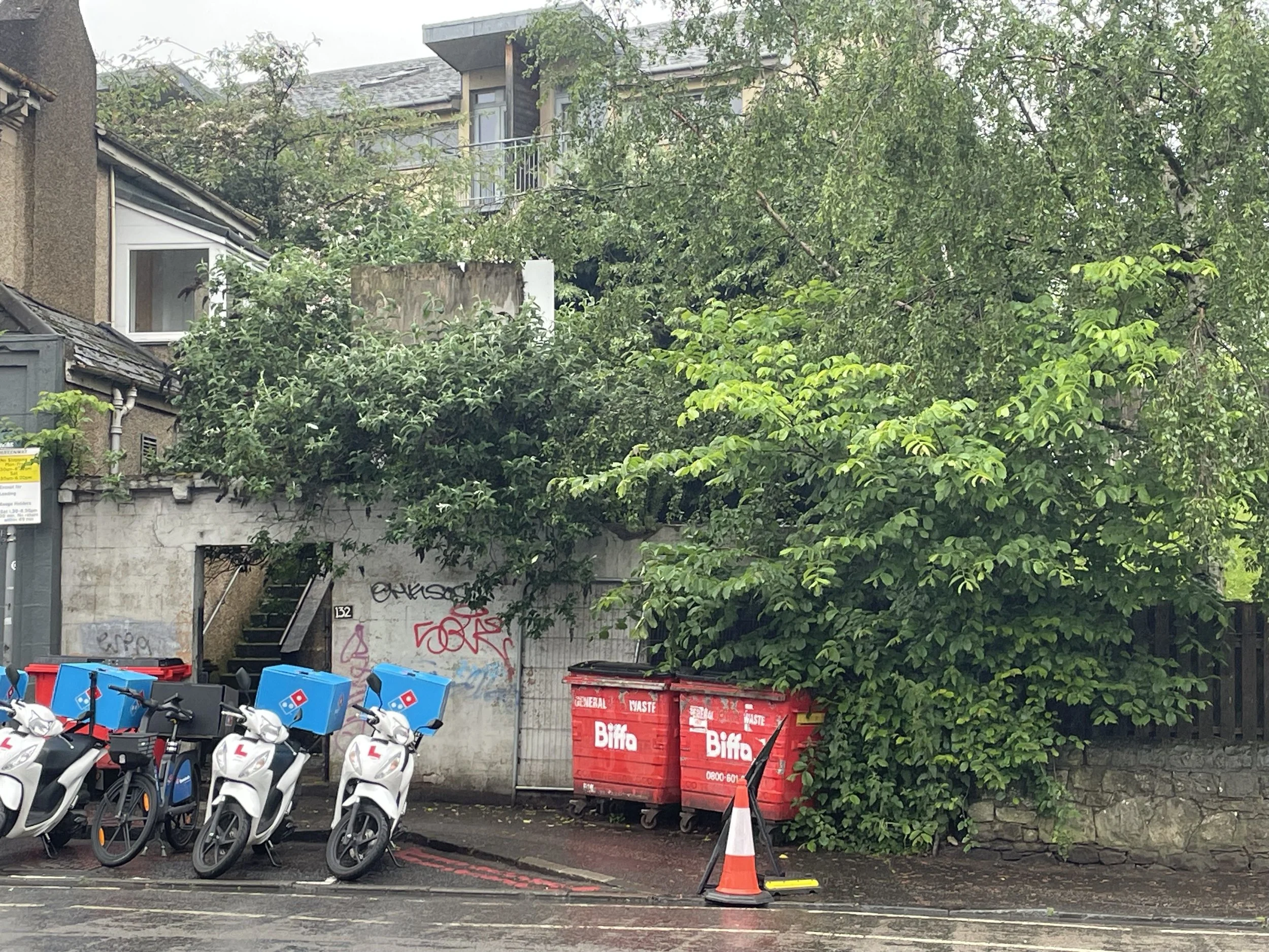 The before photo showing the area where a new property will be built