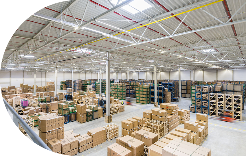 A photograph depicting a warehouse filled with cardboard boxes.