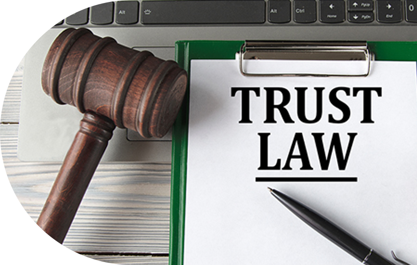 A photograph depicting a document titled “Trust Law”.