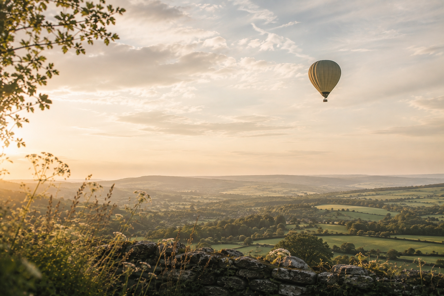 Hot air balloon rising over the countryside, symbolising emotional freedom, perspective, letting go of overwhelm and moving forward.