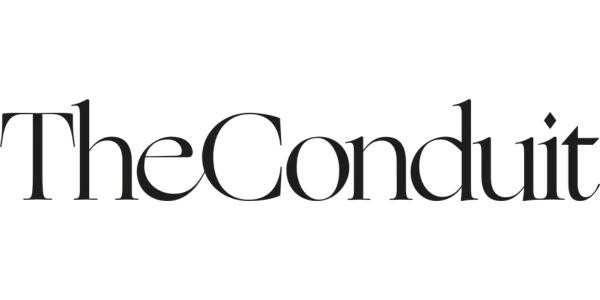 The logo of The Conduit, featuring the words 'The Conduit' in black text.