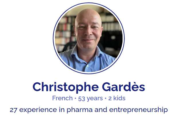 Profile picture of Christophe Gardès, a 53-year-old French man with a bald head and wearing a blue collared shirt, smiling in an office setting.