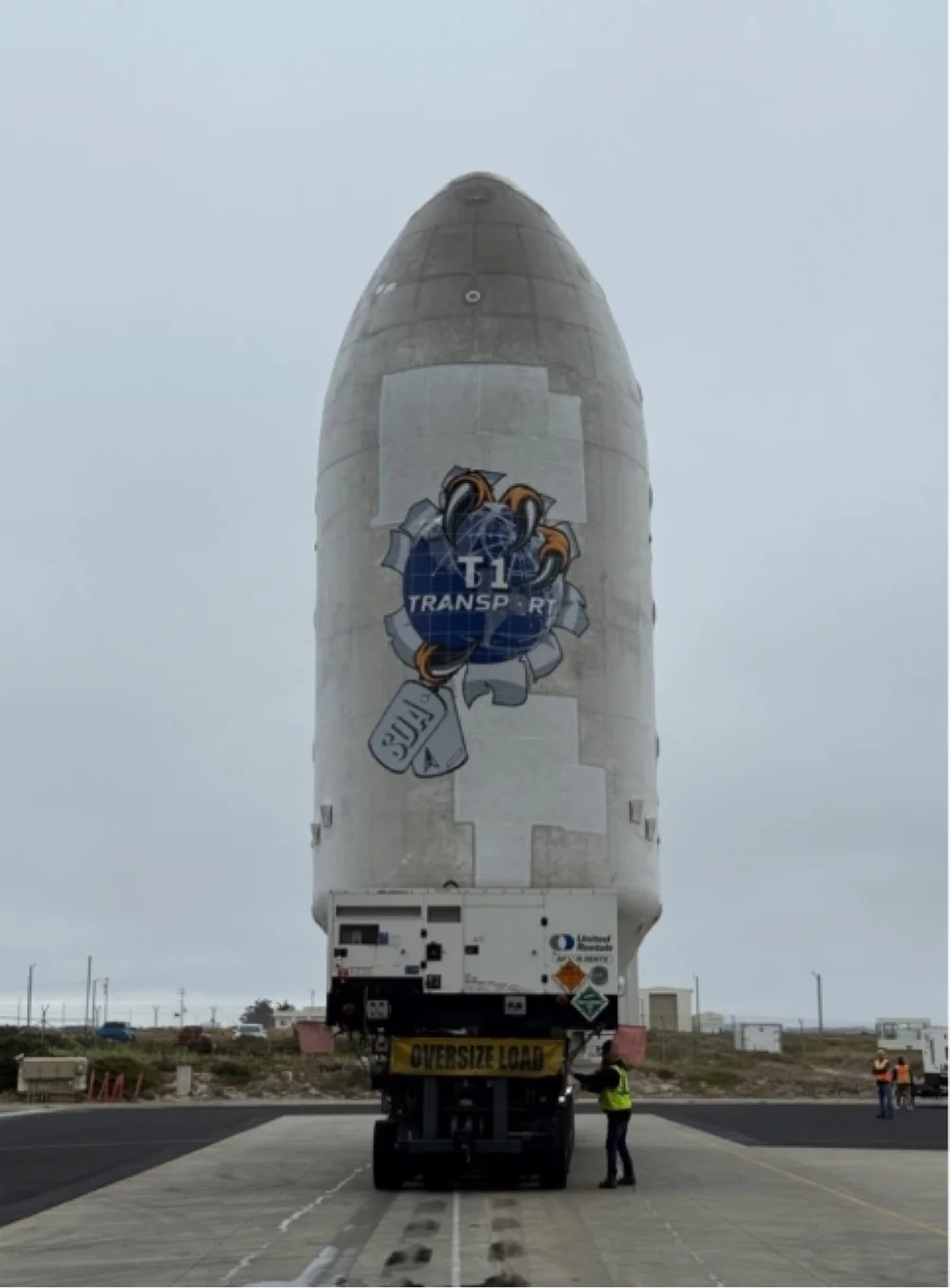 Close-up of Woody’s eagle and SDA dog-tag artwork on the rocket fairing