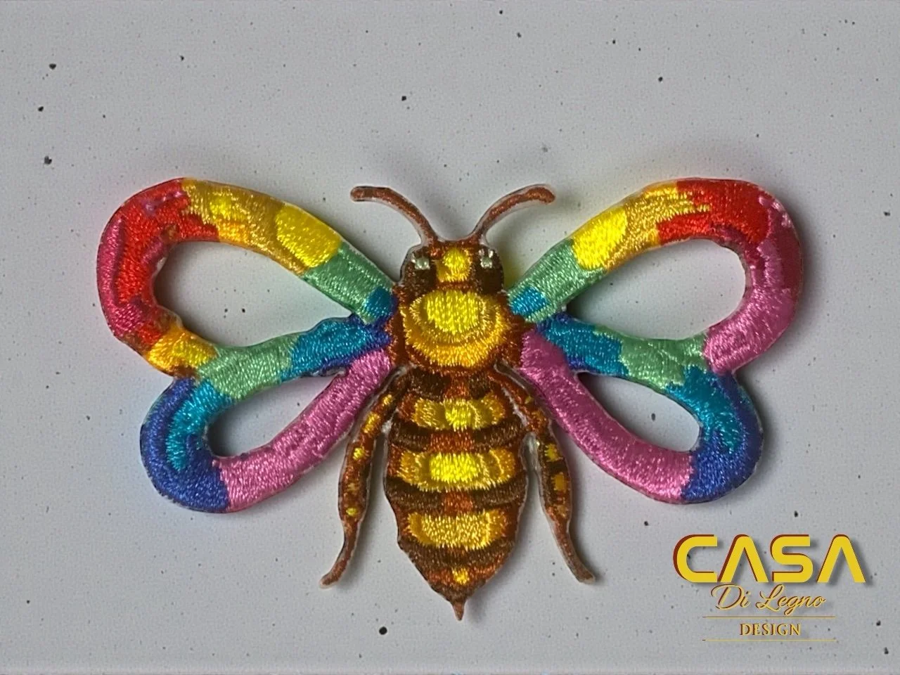 Rainbow bee patch — embroidered artwork by Woody for Casa di Legno Design