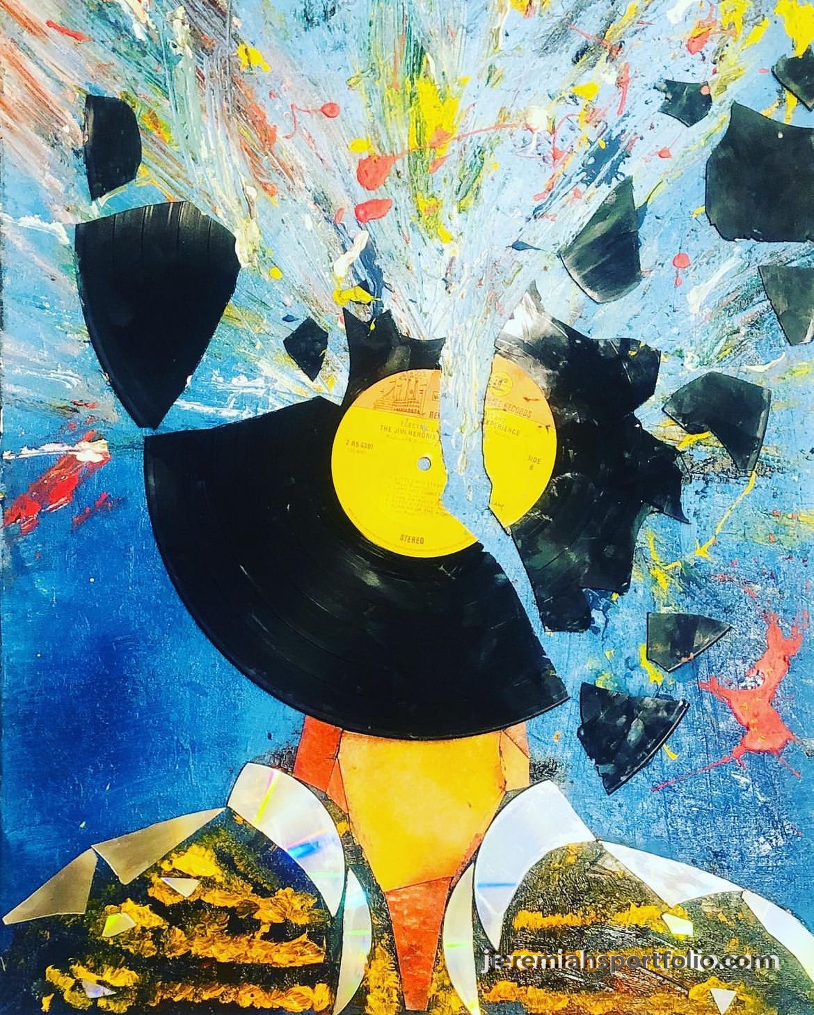 Abstract artwork featuring a broken vinyl record at the center, with colorful splashes and shards radiating outward. The background is a vibrant blue with yellow, red, and white accents.