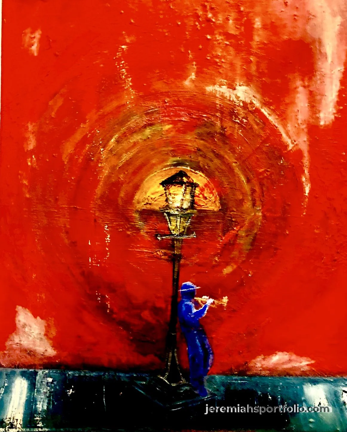 A person in a blue hoodie and pants reading a book while standing outdoors next to a tall street lamp on a dark surface. In the background is a vibrant, abstract red and orange swirling sky with a small black silhouette of a house and trees near the 