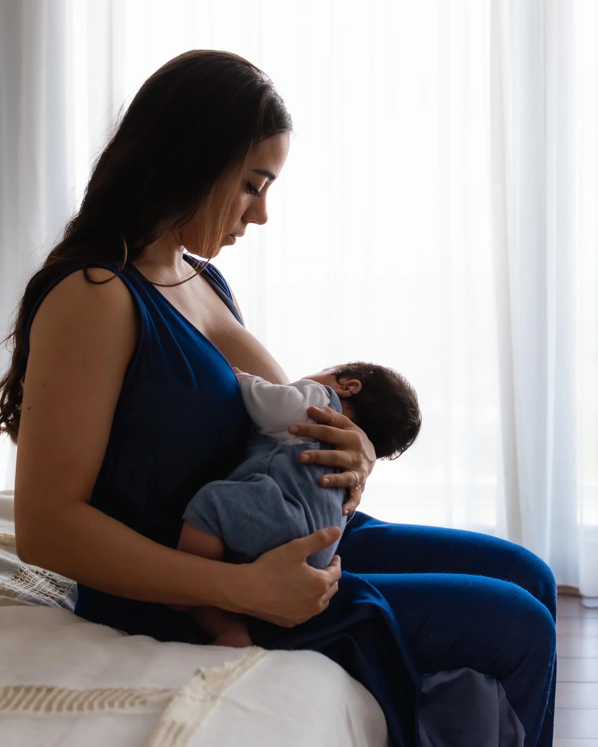 mother breastfeeding a newborn