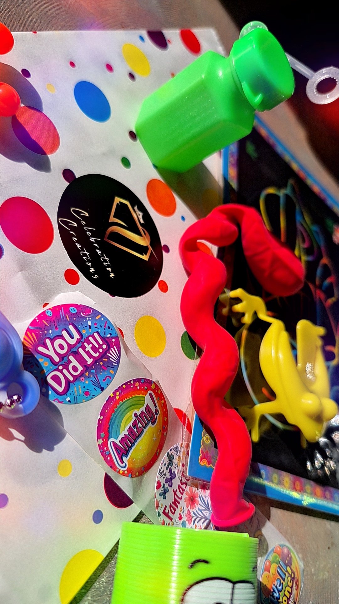 Celebration creations party bags, childrens birthdays, party favours, jumping frog toy, bubbles, party time, swirly balloon, stickers