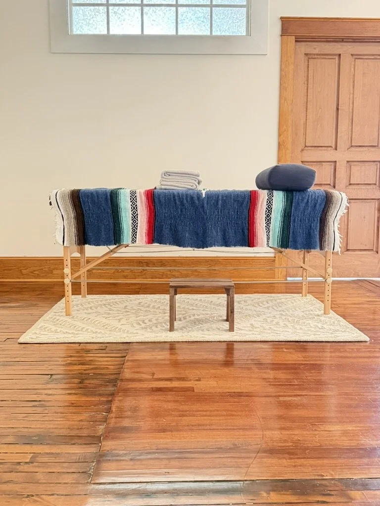 image of reiki table with blanket and pillow