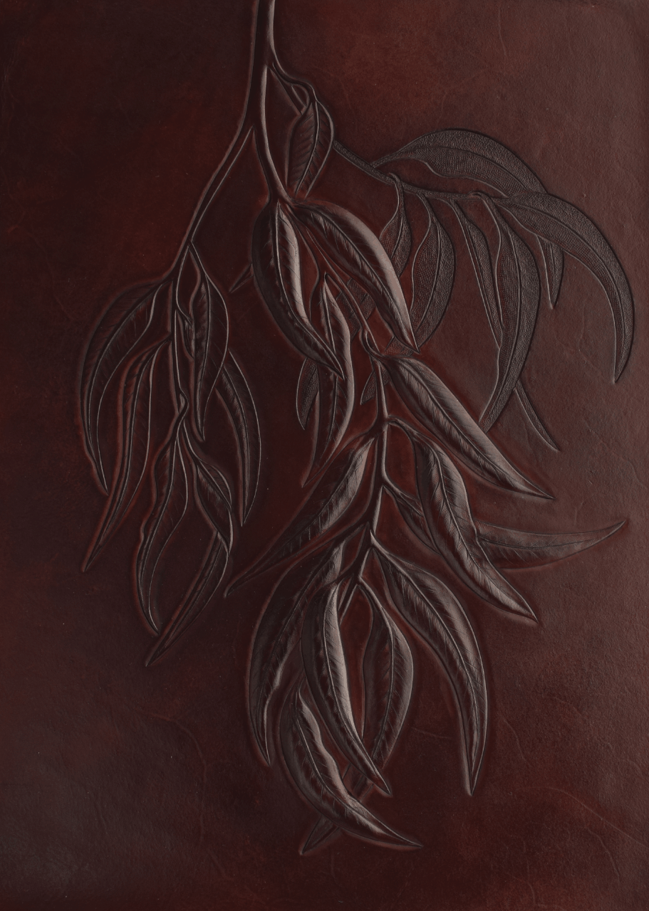 Craved decorative leather wall panel with Eucalyptus leaves.
