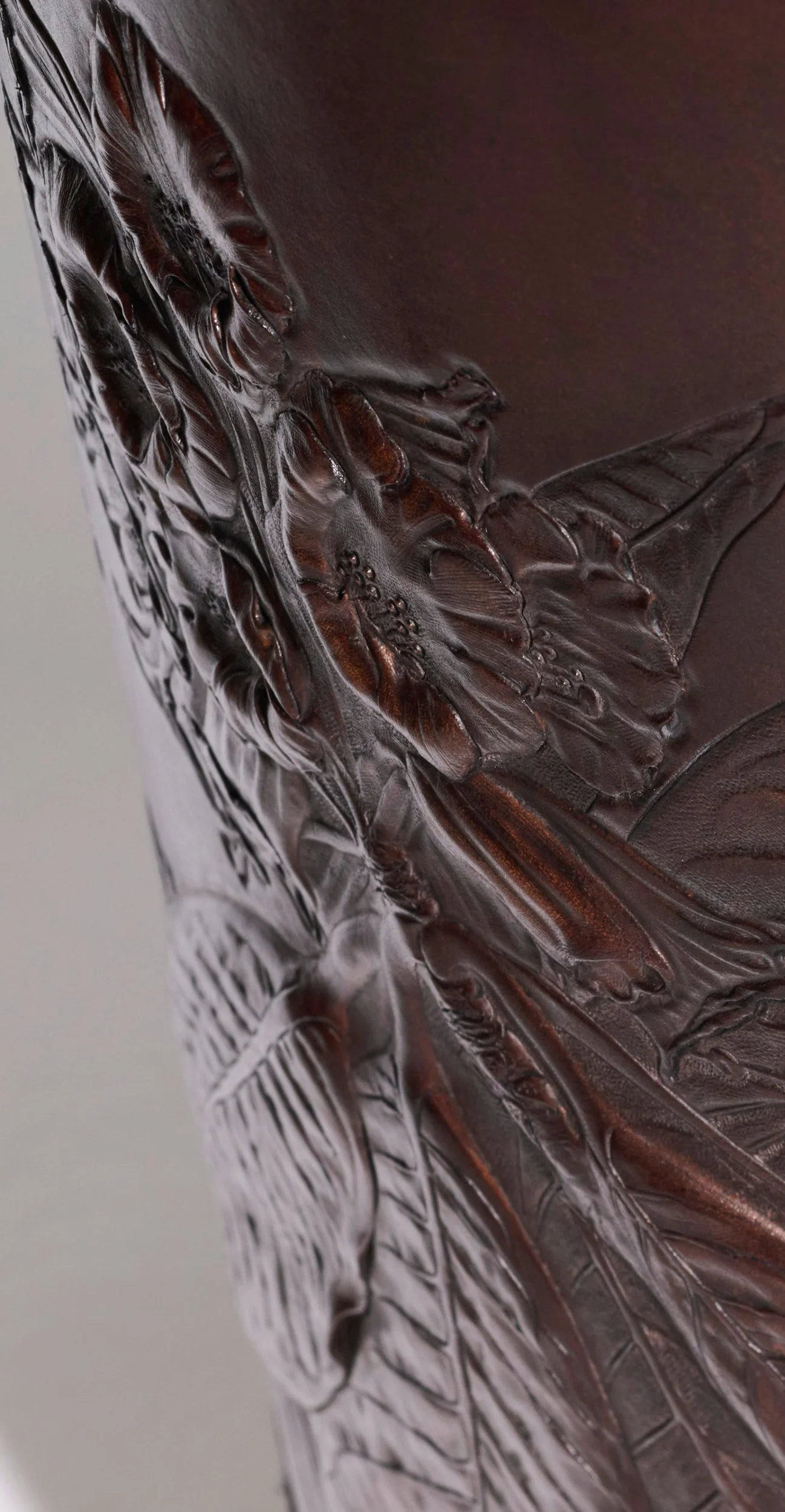 Rhododendron sinogrande, carved decorative leather vessel detail.