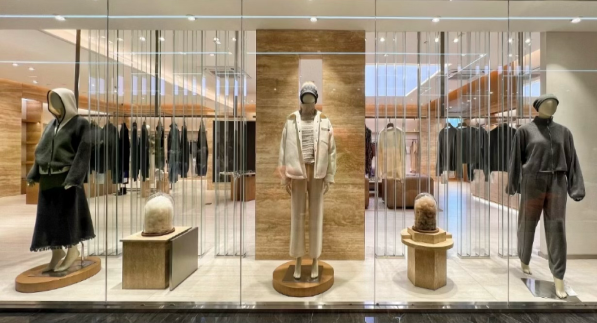 CAKO Europe store display of cream cashmere coats and knitwear