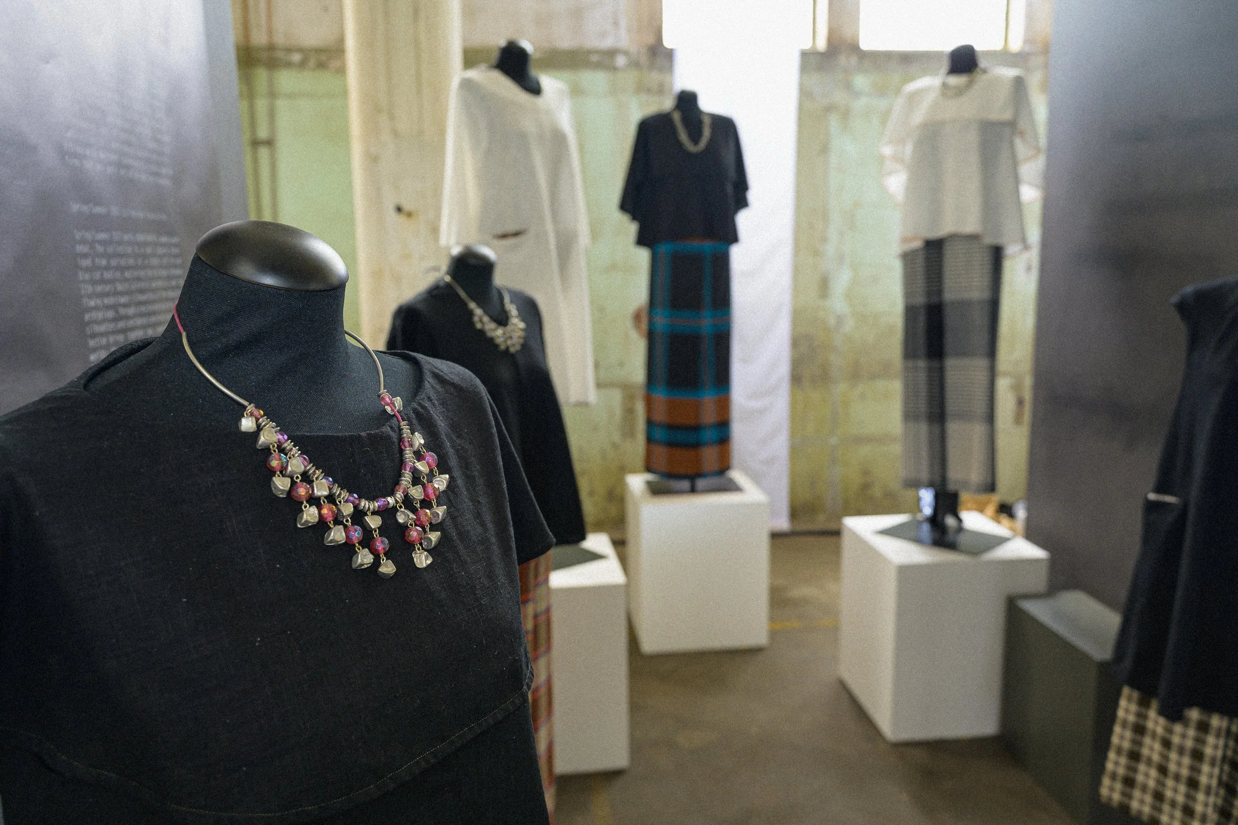 Mannequins displaying Jonathan Ho Spring/Summer 2027 collection pieces with layered necklaces