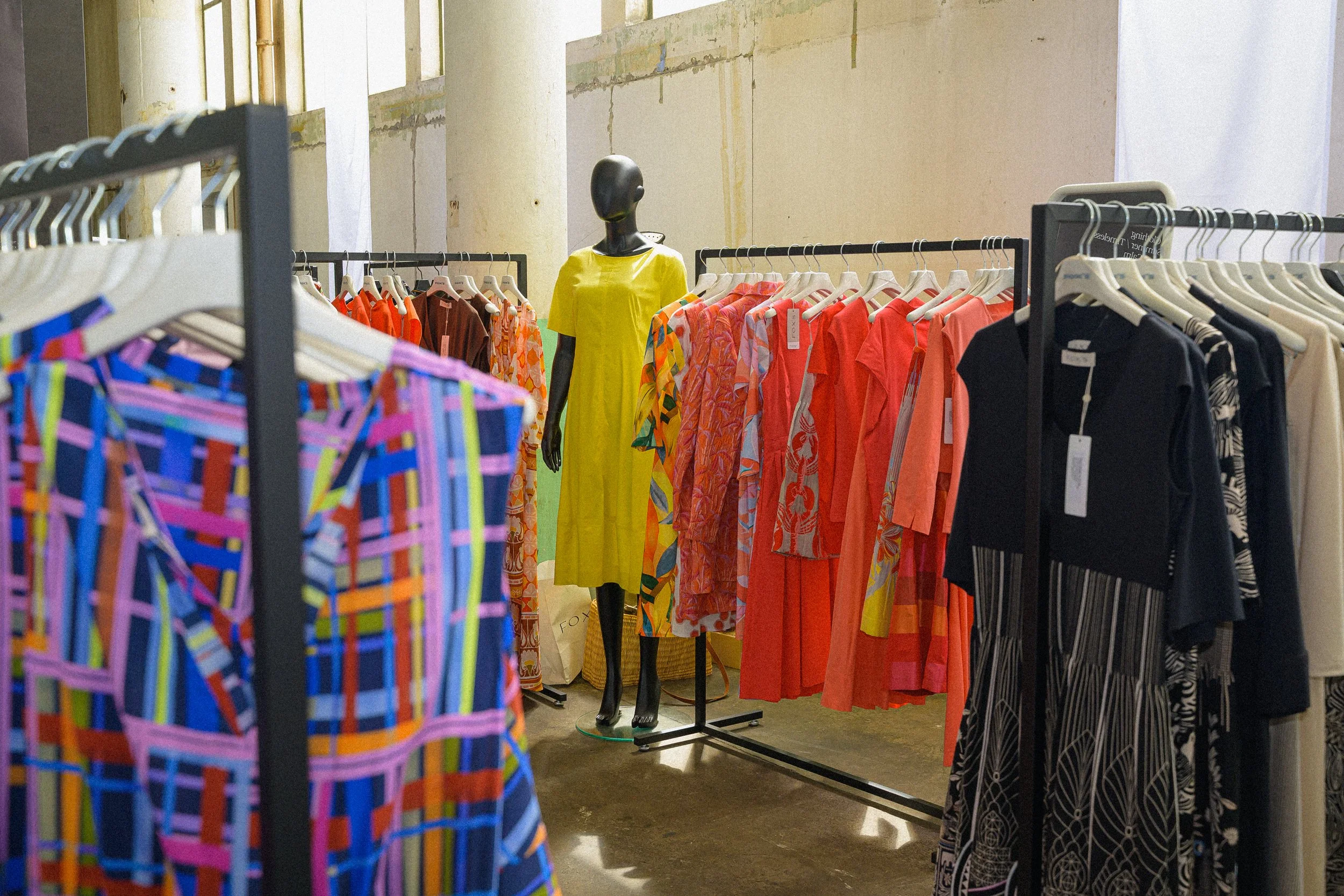 foxs-gallery-store-display-yellow-dress-orange-rack.jpg