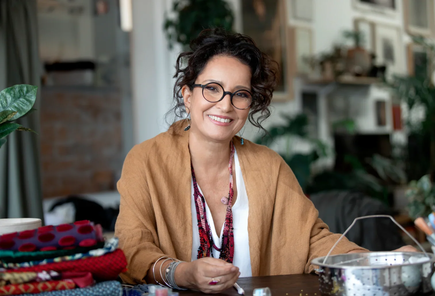 Ayala Bar, jewellery designer, smiling in her studio