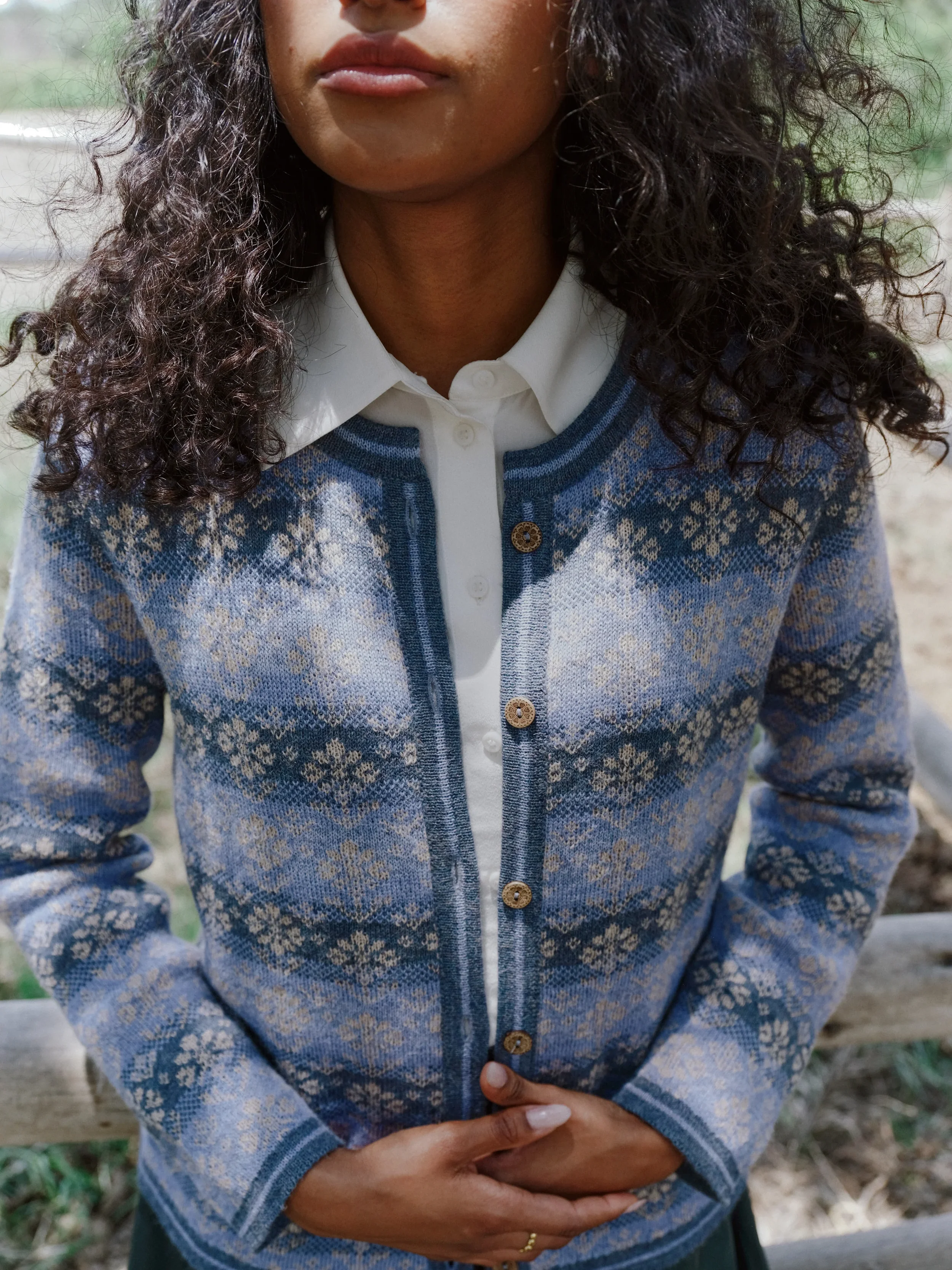 Manuela Bedford close-up of a woman wearing a knitted alpaca cardigan