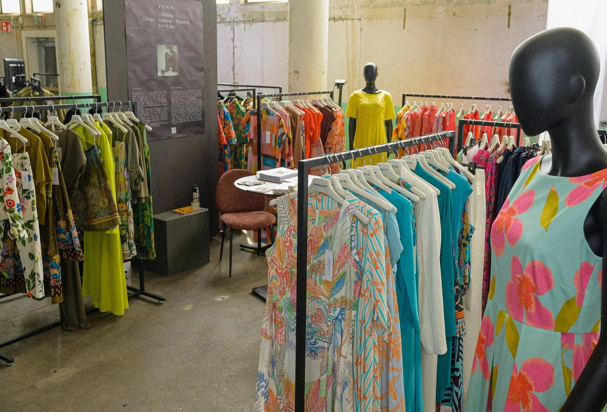FOX'S store display of colourful summer clothing rack with mannequin