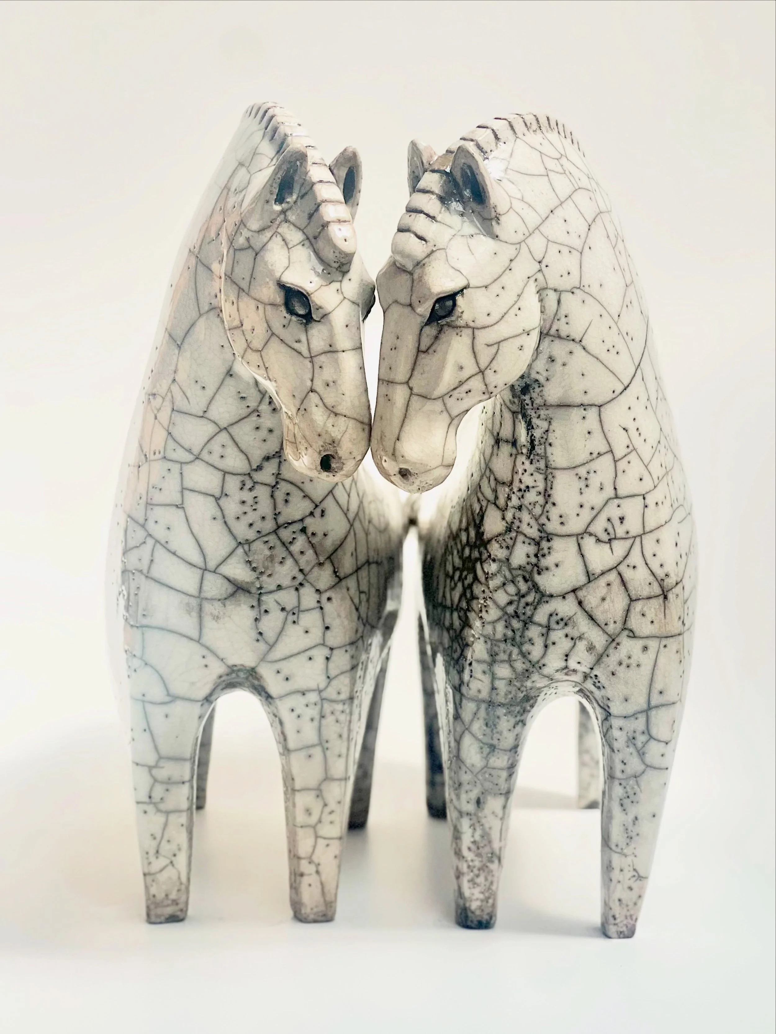 Sisters 👯&zwj;♀️ 

A very special commission for two sisters. Designed to belong together but also work as stand alone pieces. A way to remind them of each other whilst they are far apart 🌍 

Made in stoneware and raku fired with a crackle glaze. 
