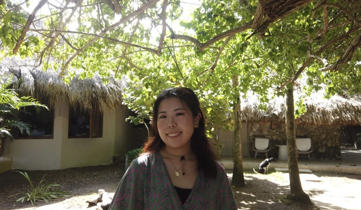Portrait of Vancouver-based Brand & Graphic Designer Ayaka Kamimura smiling outdoors.
