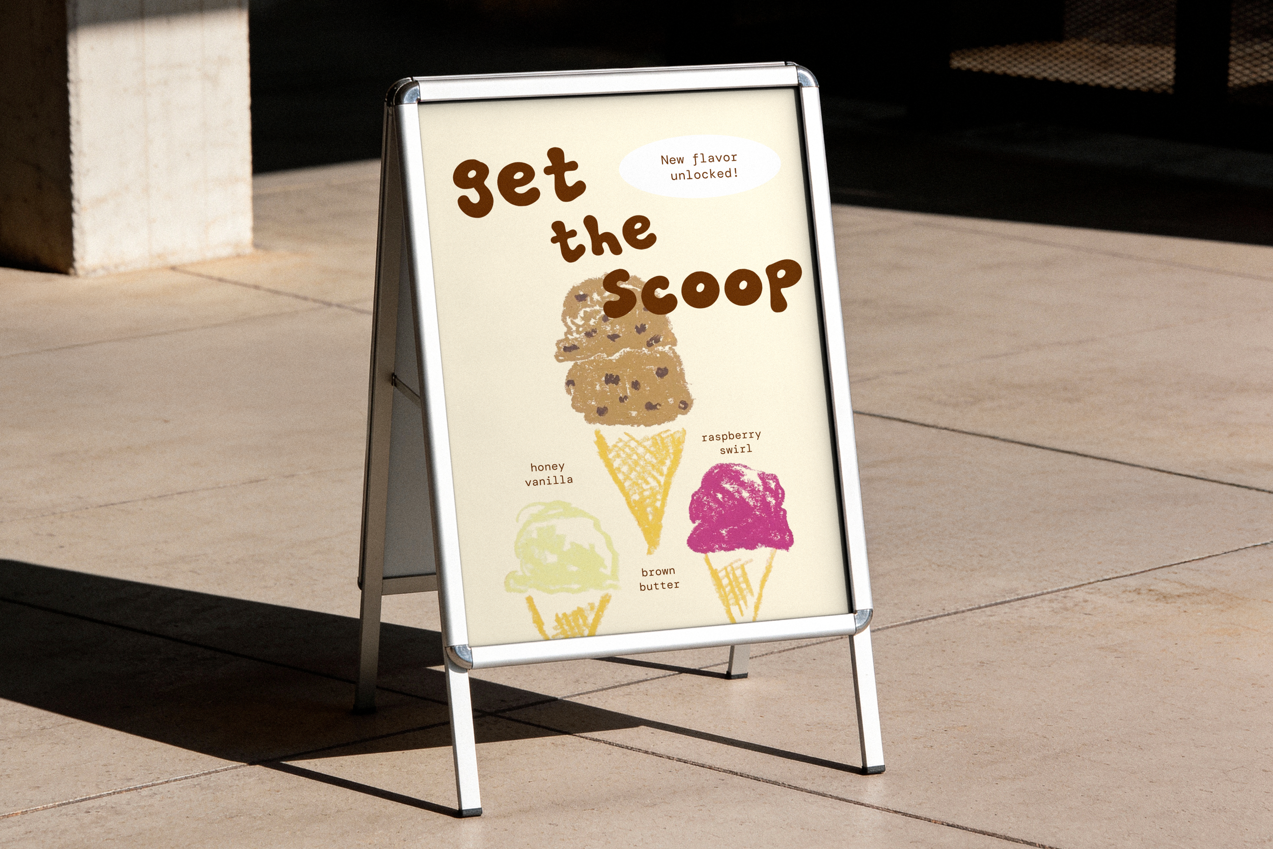 A ice cream board sign outside on a sidewalk advertising ice cream flavors including honey vanilla, raspberry swirl, and brown butter.