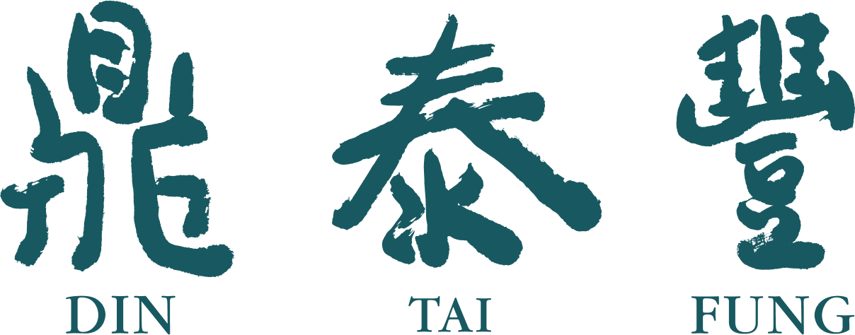 Three Chinese characters with the words DIN, TAI, FUNG underneath each, all in blue on a black background.