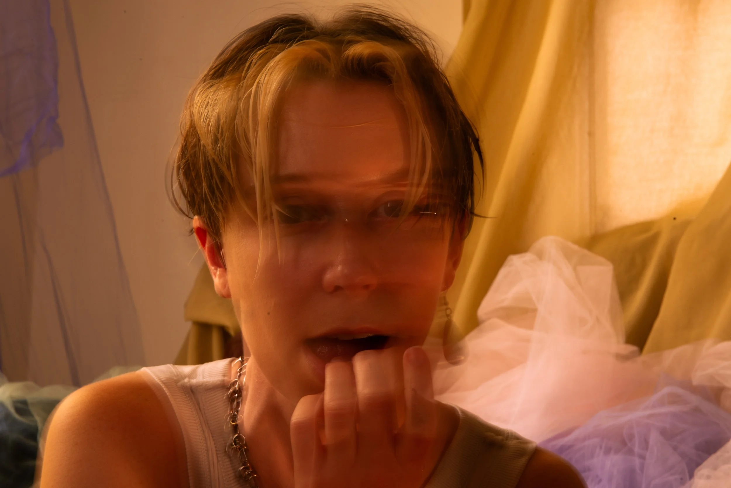 Person with blurry face looks at camera