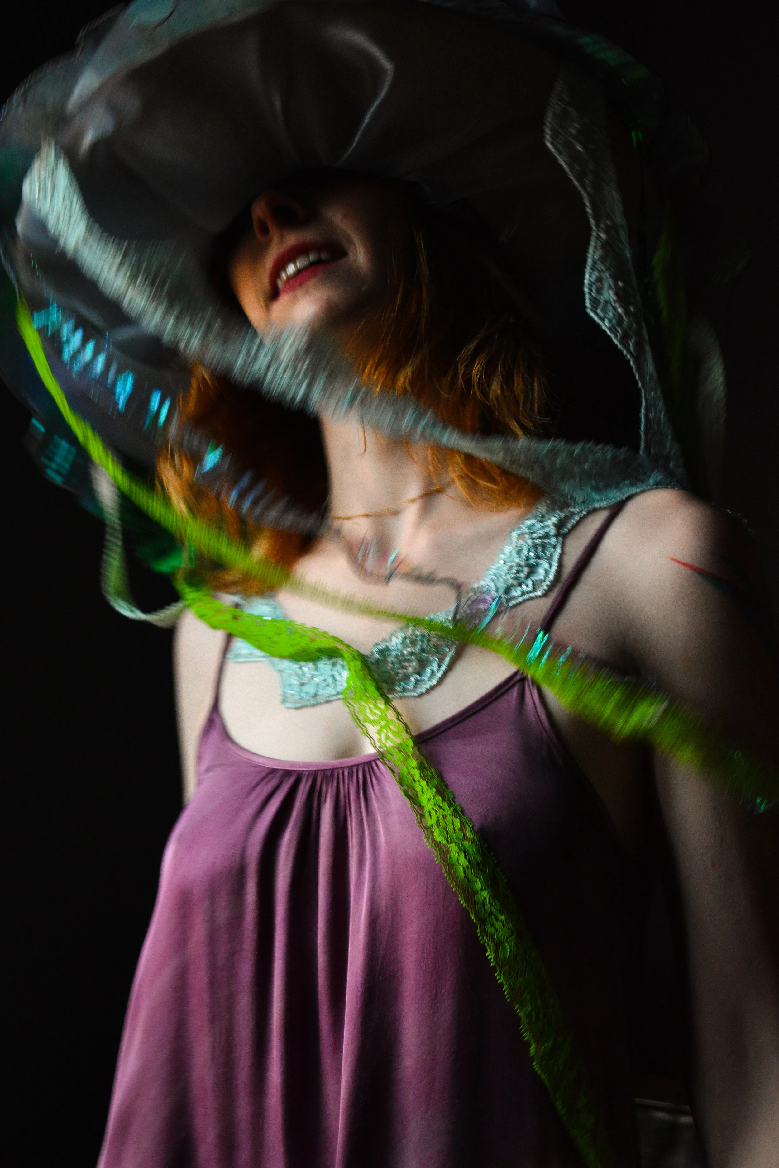 Person with jellyfish hat spins