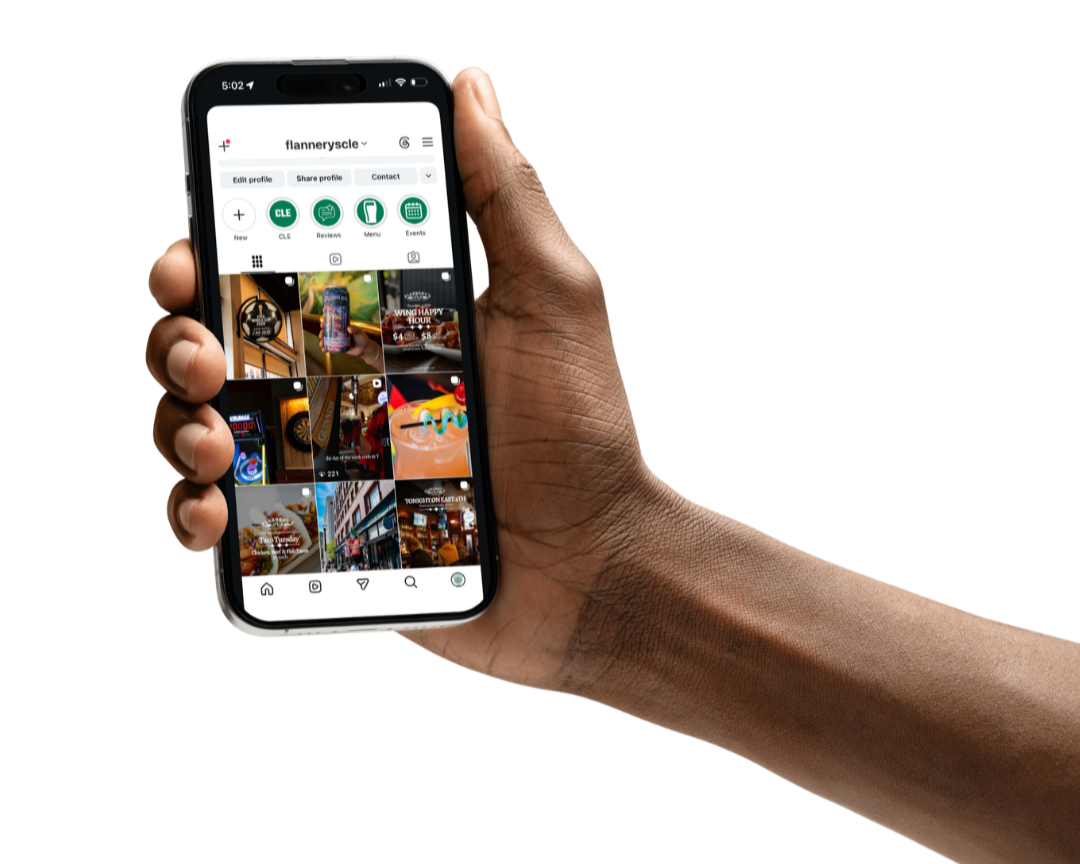 Hand holding phone displaying Flannery's Pub Instagram Page in Downtown Cleveland