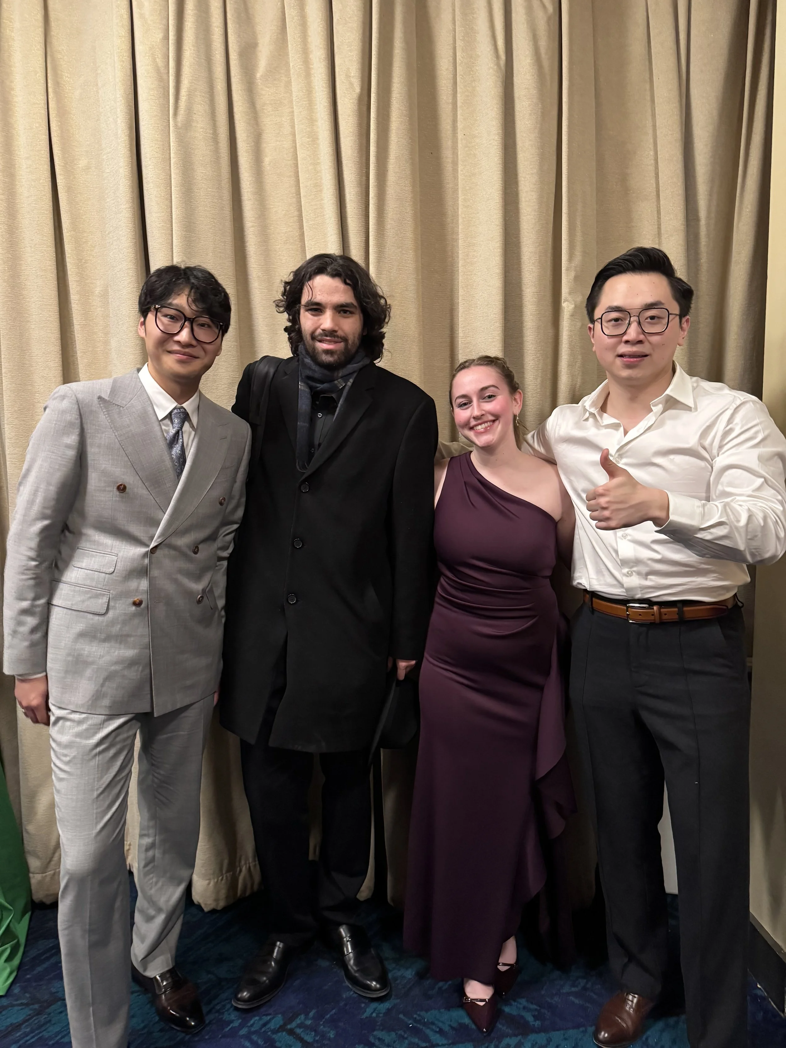 Photo with composer Tongyu Lu, soprano Piper Weldon, and conductor Avery Davidson following the premiere of Blumen, Liebesgedanken, Rauschen, Tongyu Lu’s double concerto for saxophone and soprano voice