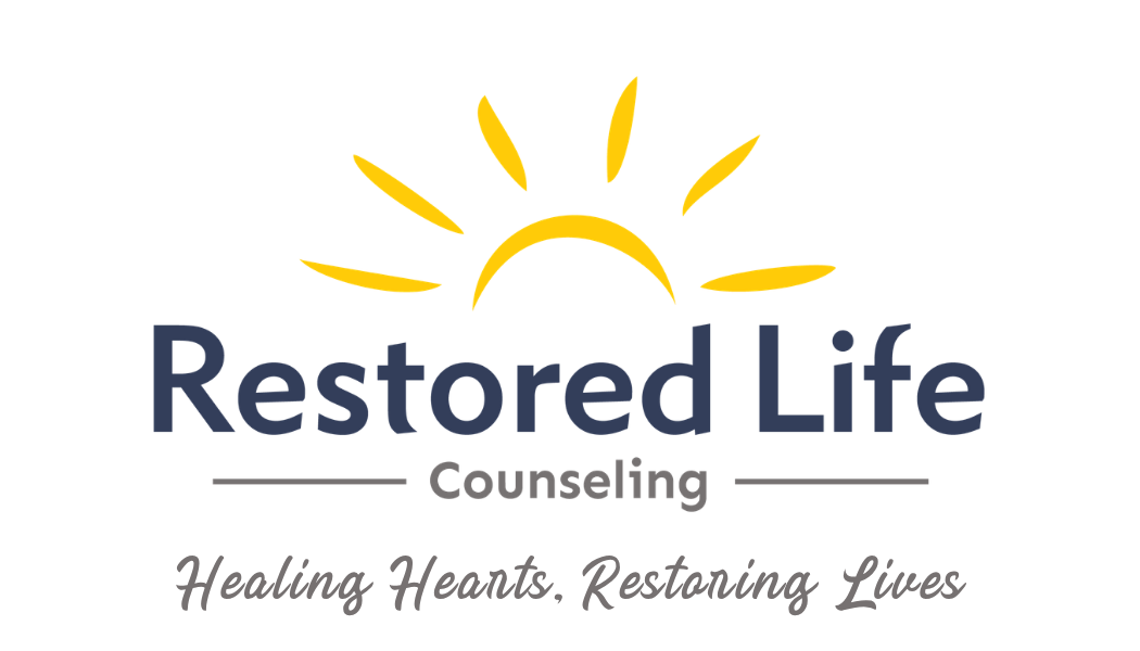 Logo for Restored Life Counseling with a yellow sun rising or setting above the text 'Restored Life' and the tagline 'Healing Hearts, Restoring Lives'.