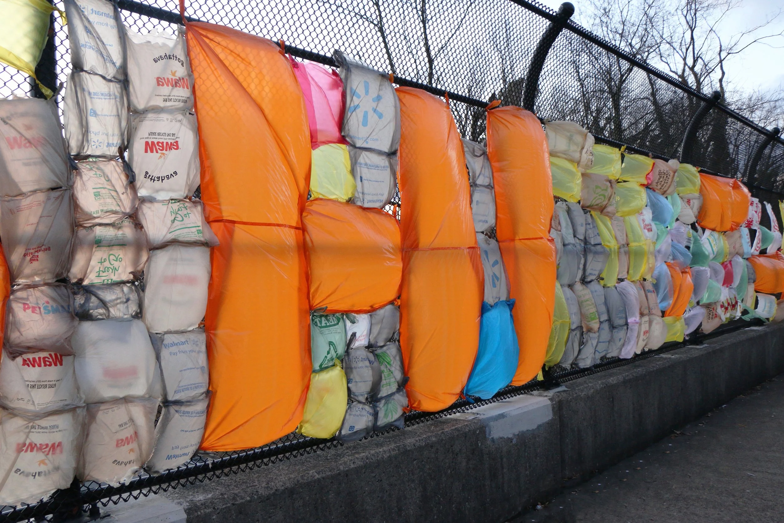 Contemporary artist Sarah Heyward's public art project near Philadelphia. Colorful recycled materials and community contributions.