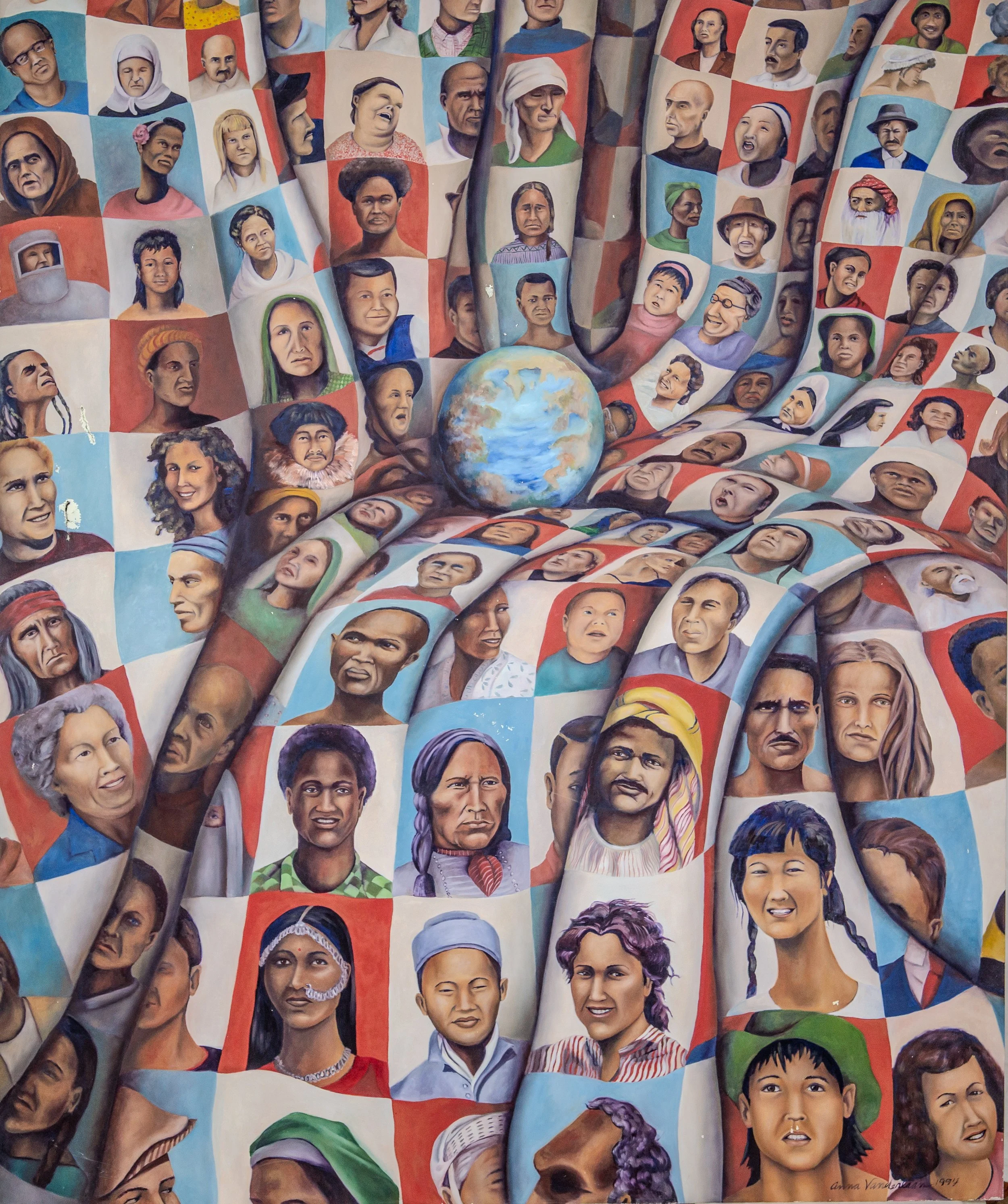 A mural depicting numerous diverse portraits of women from different cultural backgrounds, holding a globe representing unity and global sisterhood.
