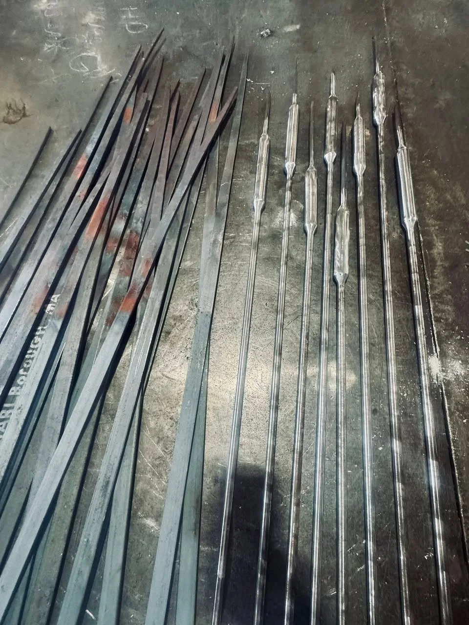 In progress metal work on workshop floor.
